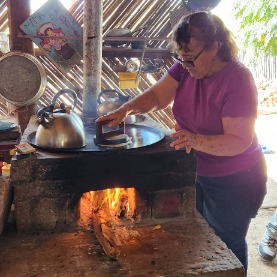 Chary demonstrates her tortilla technique at Rancho Viejo